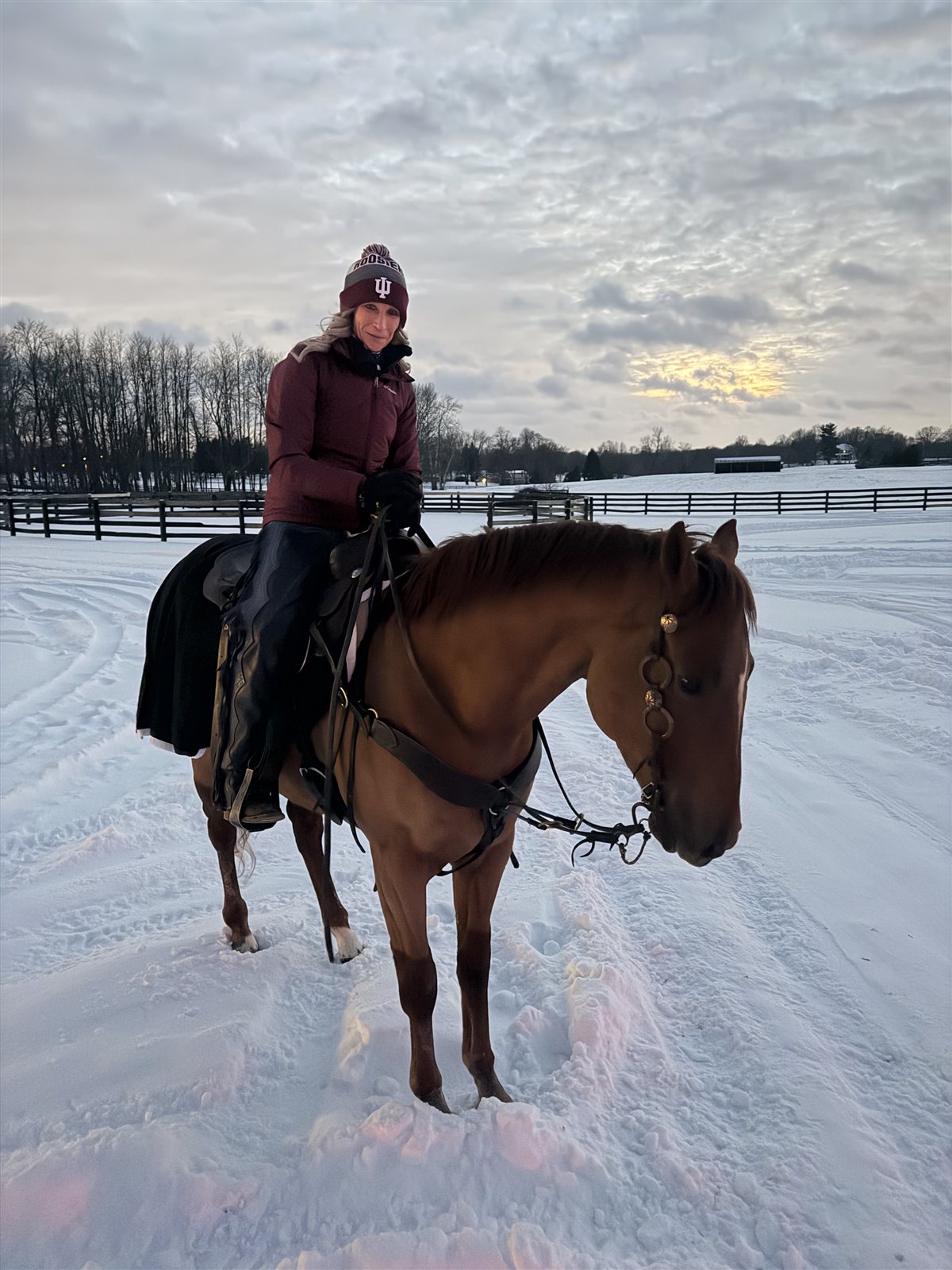 Danielle Rosier riding through the snow at Blue Skies Horse Farm